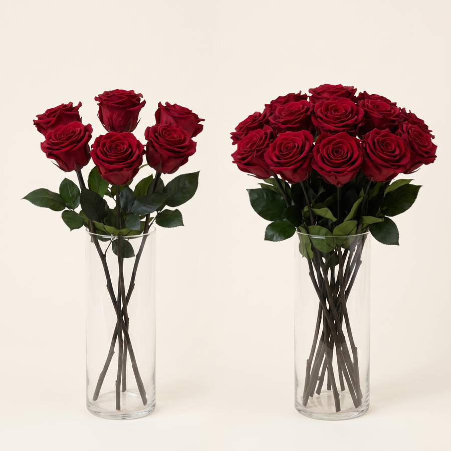 Dark red long stem preserved roses styled in a vase on a console table