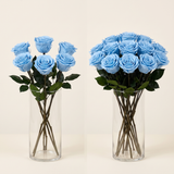 Blue long stem preserved roses arranged in a glass vase