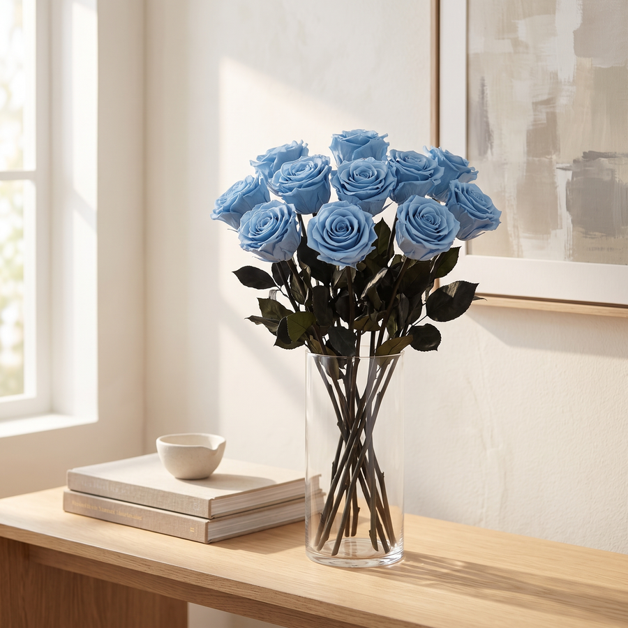 Blue long stem preserved roses styled in a vase in a modern living room