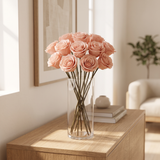 Pink long stem preserved roses arranged in a glass vase